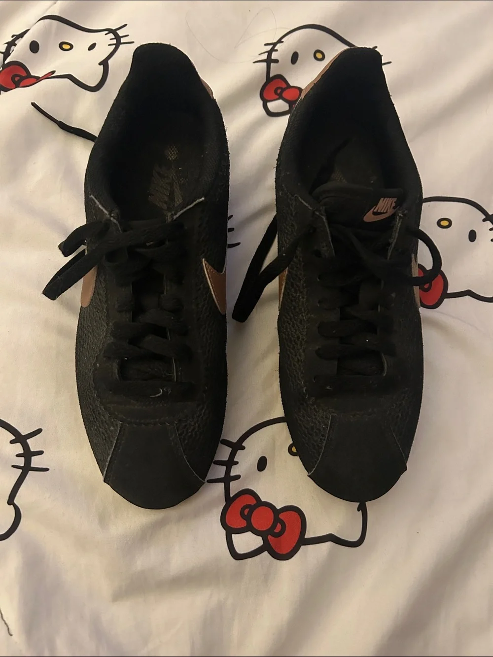 Nike Black Low-Top Sneakers with Bronze Swoosh